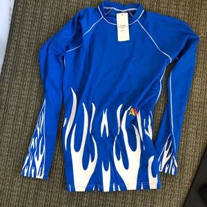Blue firepower rash guard. New with tags. Size S.